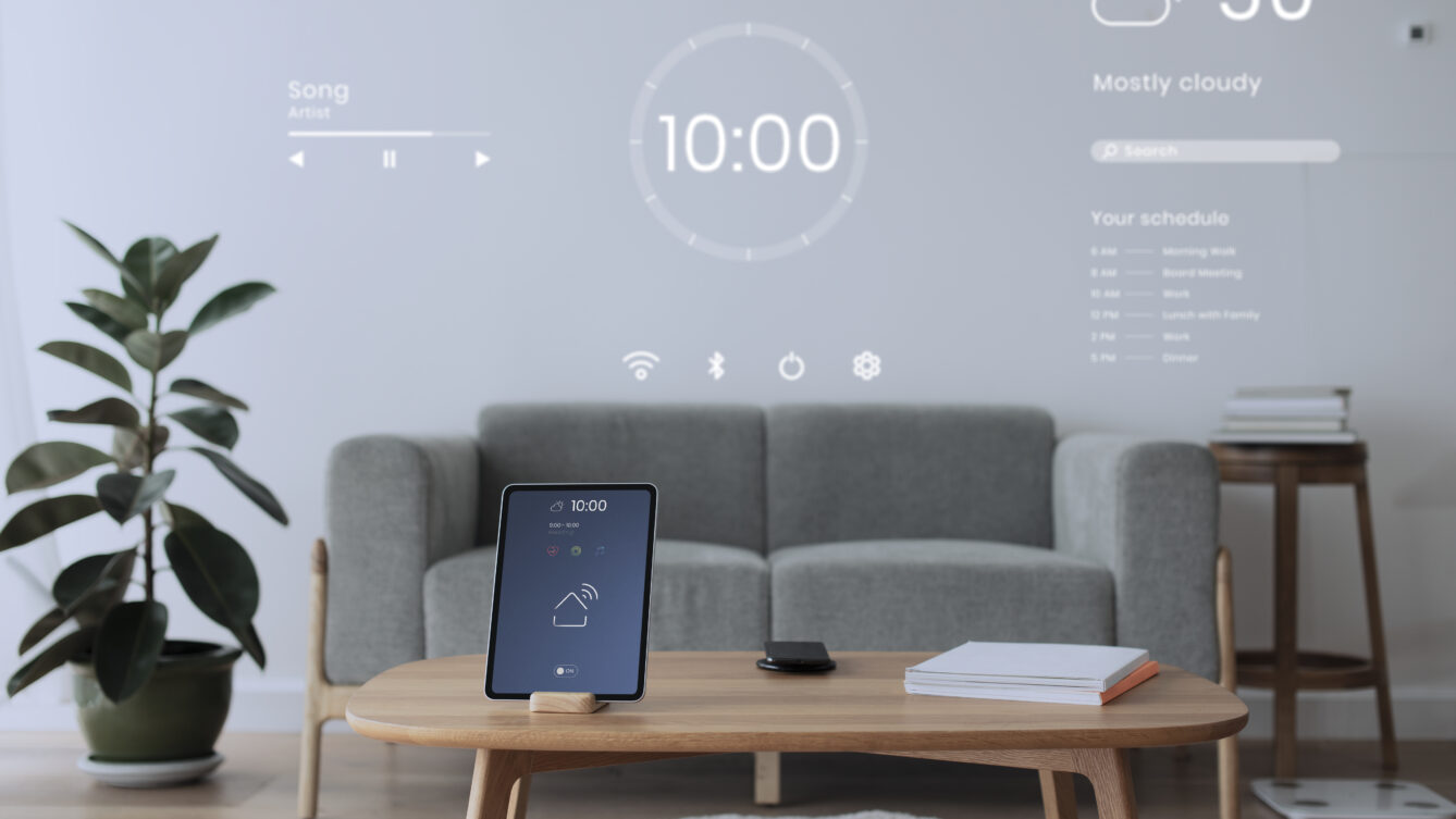 Digital tablet screen with smart home controller on a wooden table