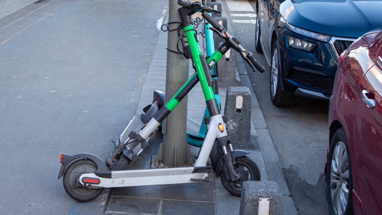 a scooter is parked on the side of the street