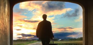 man holding luggage photo