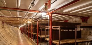 a long row of benches inside of a building