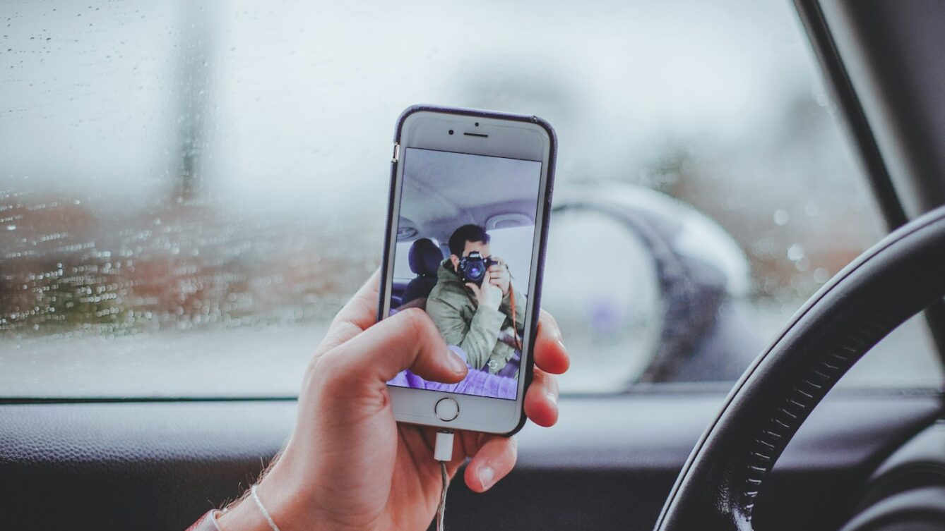 person taking selfie inside the car