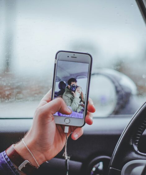 person taking selfie inside the car