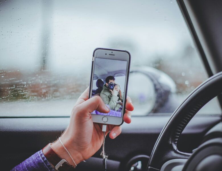 person taking selfie inside the car
