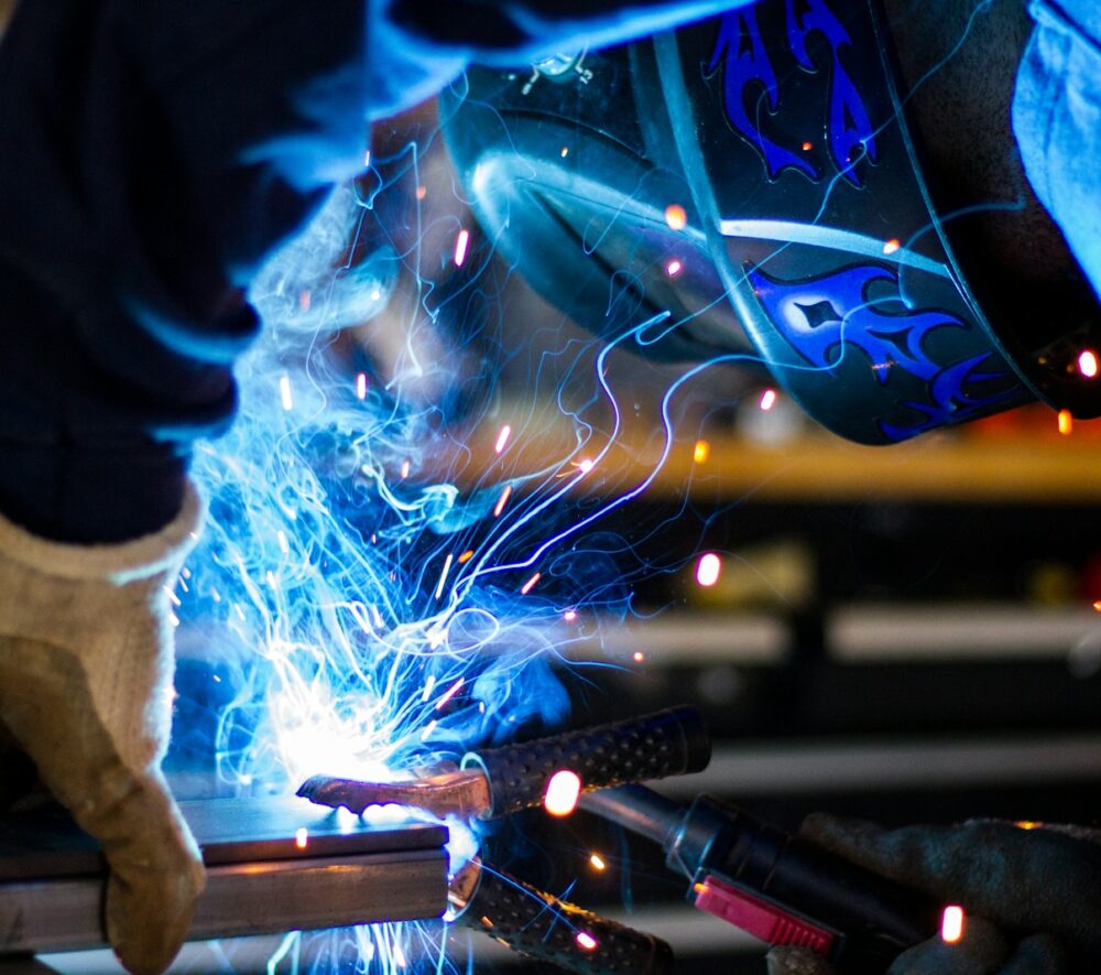 man holding gray steel frame