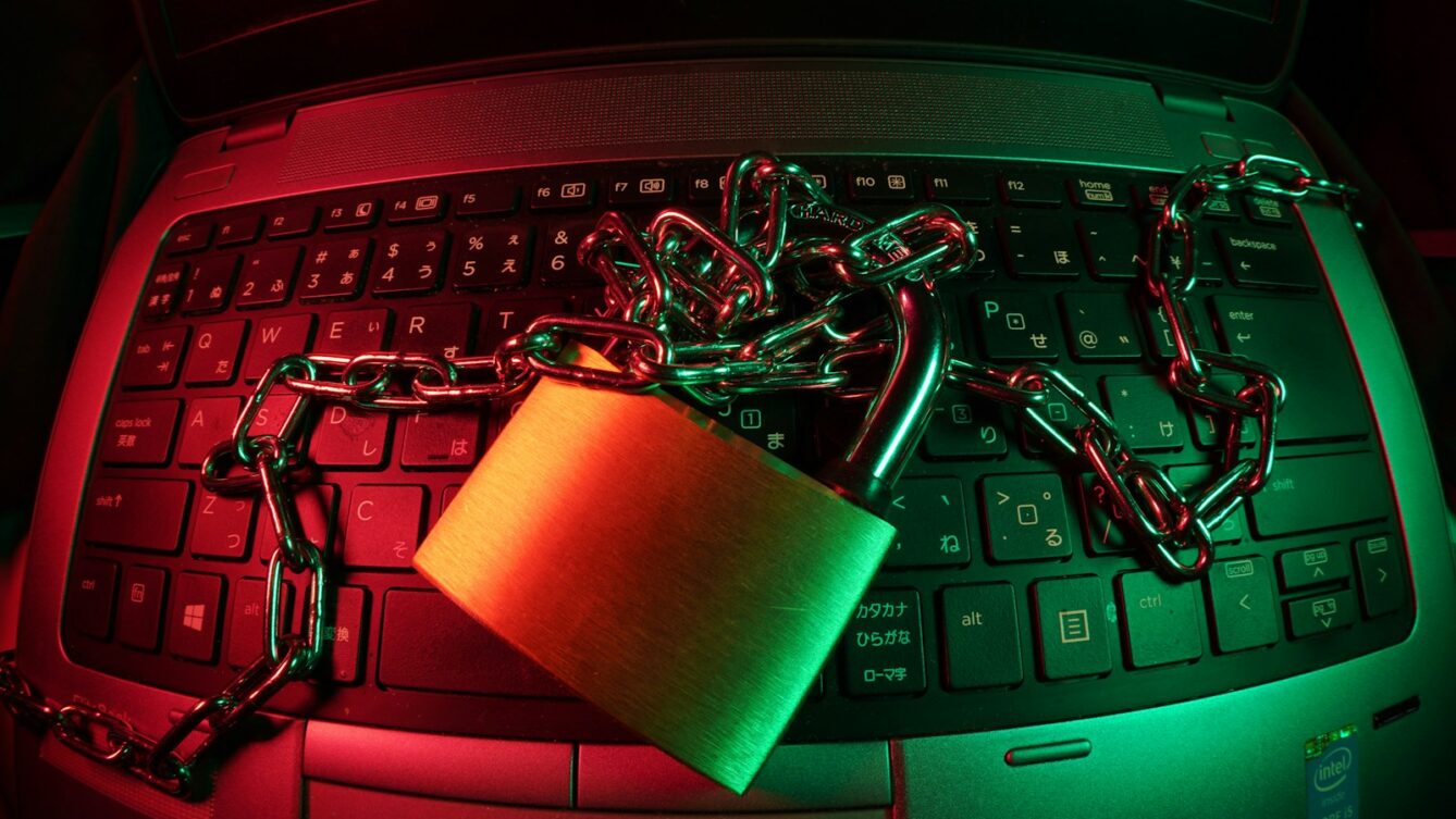 brown padlock on black computer keyboard/ FlyD/ Unsplash