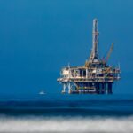 an oil rig in the middle of the ocean