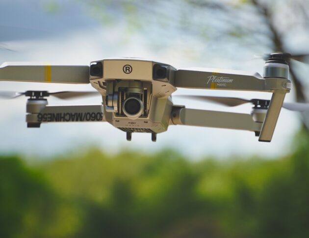black and gray drone flying during daytime