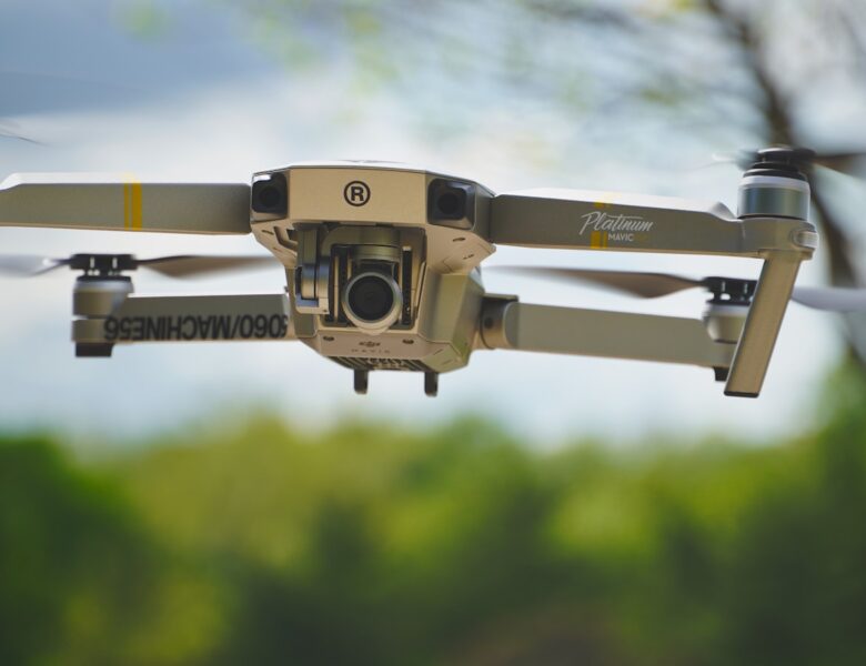 black and gray drone flying during daytime