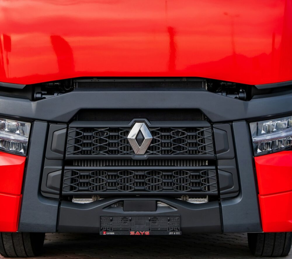 a close up of the front of a red truck