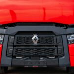 a close up of the front of a red truck