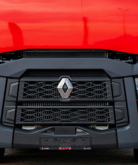 a close up of the front of a red truck