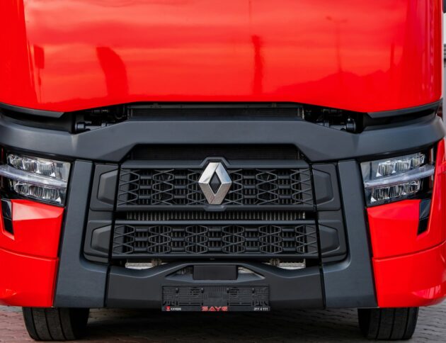 a close up of the front of a red truck
