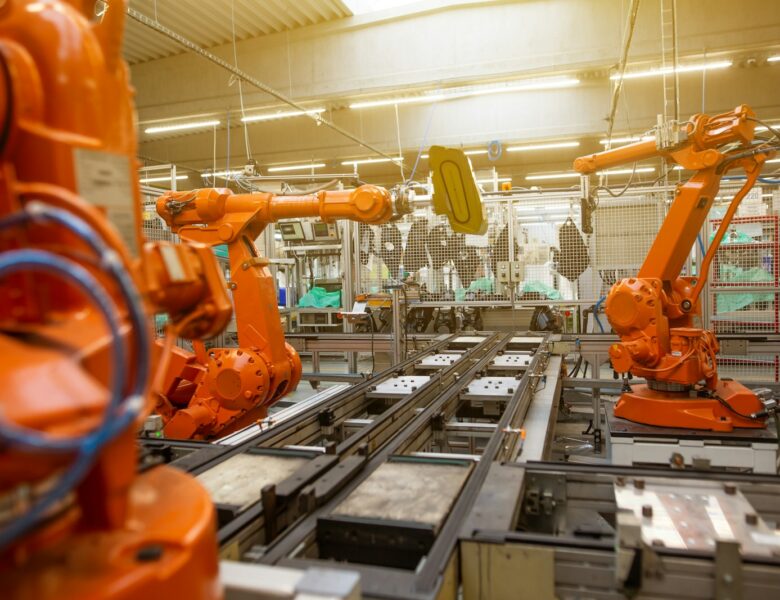 a factory filled with lots of orange machines