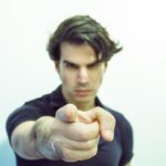 man pointing at camera