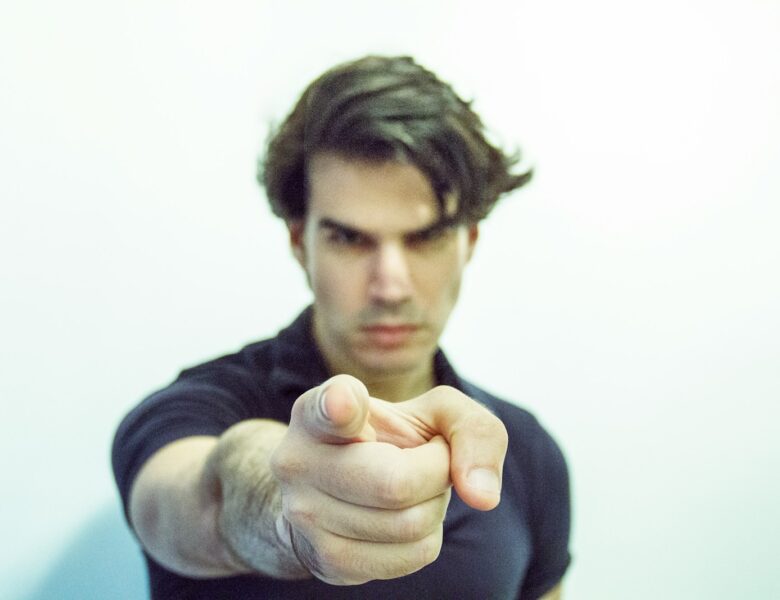 man pointing at camera